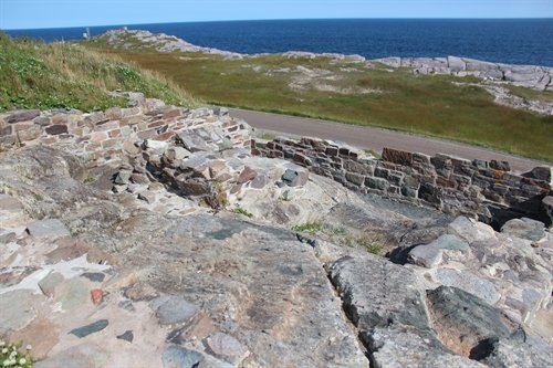 These are ruins from the 1st (1734) and 2nd (1842) lighthouses at Louisbourg.  These ruins are located at the base of the current lighthouse.