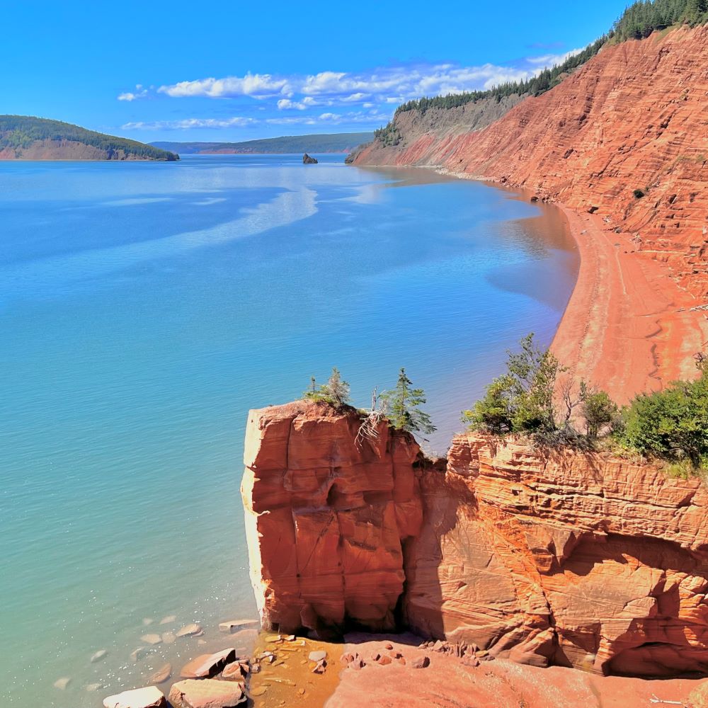 A view from the tip of the Red Head trail at high tide. A spectacular view of the sandstone cliffs and the gorgeous Bay of Fundy tide.